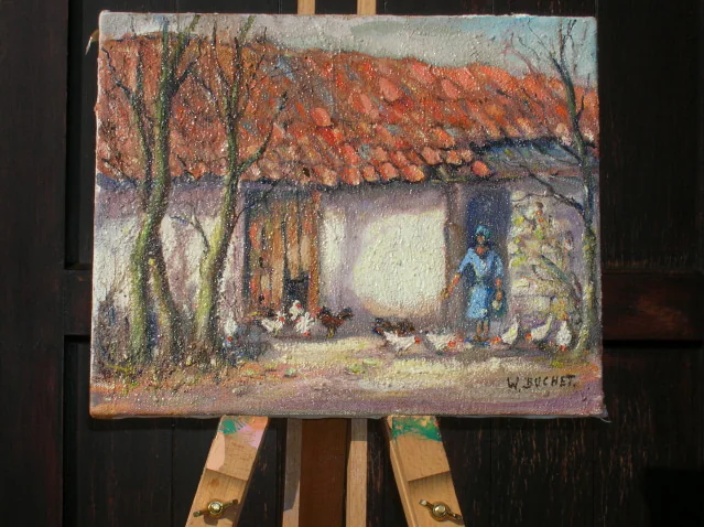 Une maison au toit rouge, toile posée sur un chevalet.